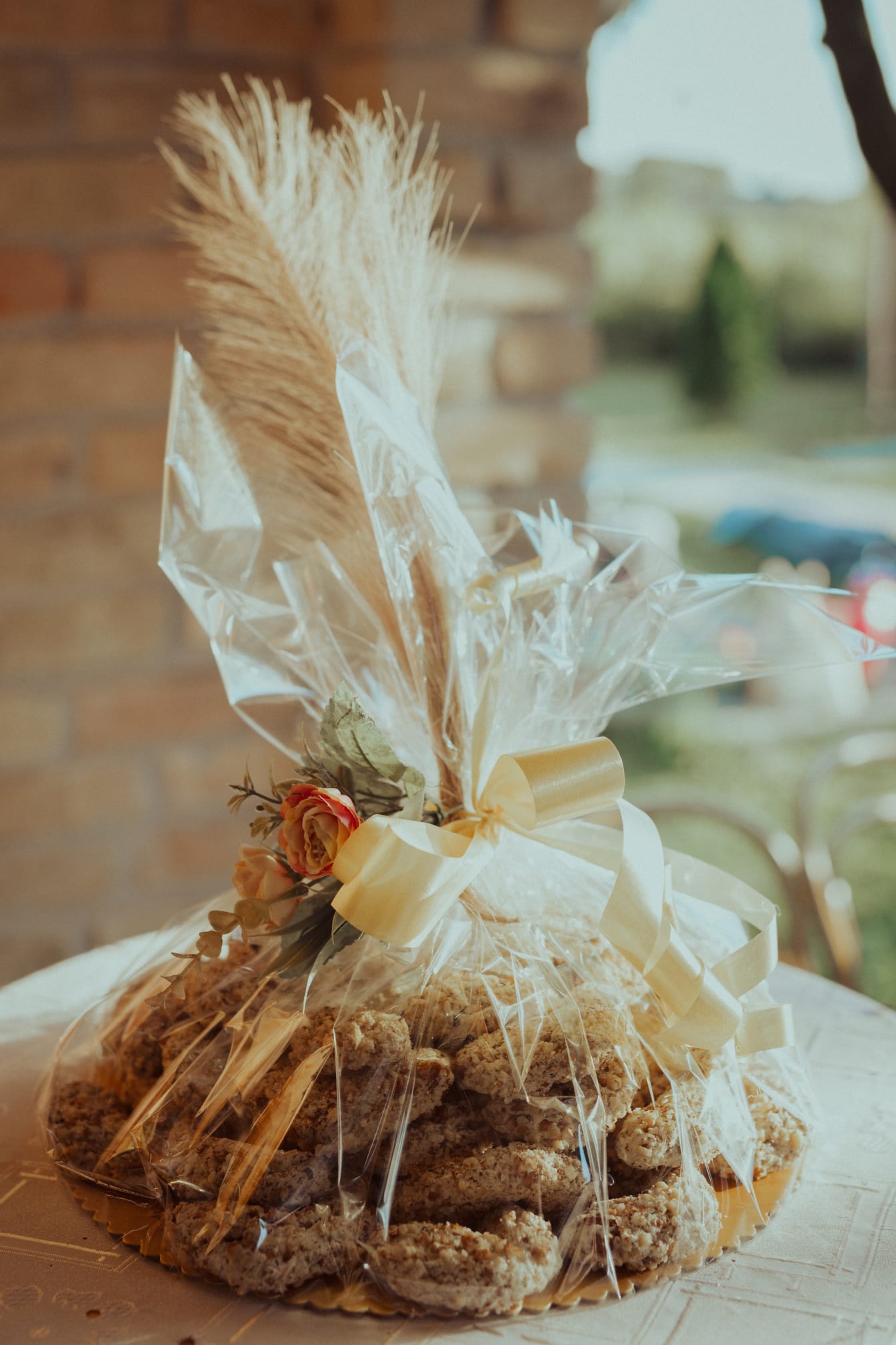 Handmade biscuits in decorative rustic package on table