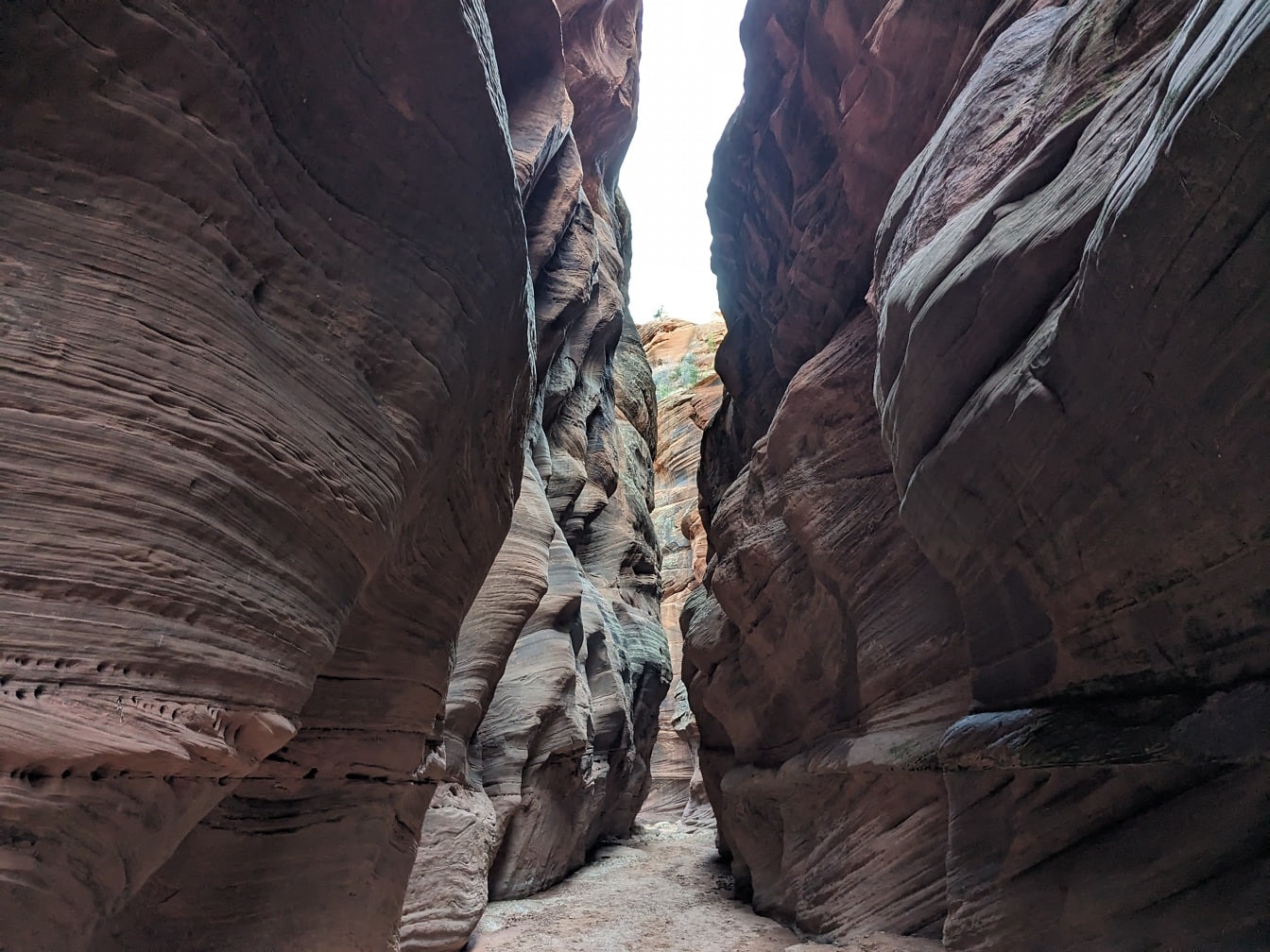 Shadow in narrow passage in canyon in desert natural park