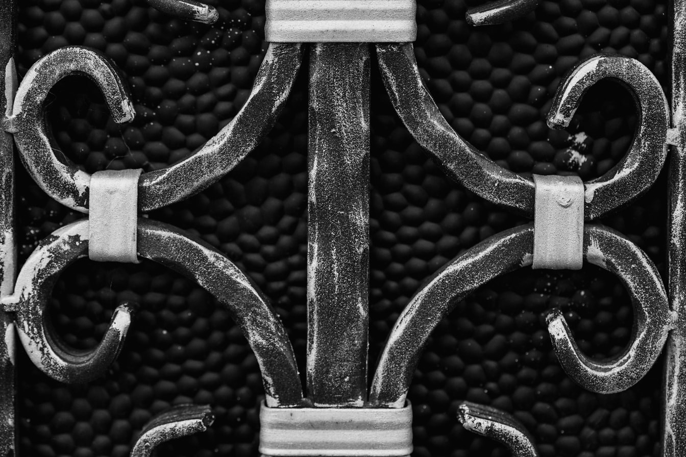 Cast iron fence close-up monochrome photo