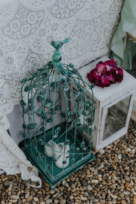 Green rustic cast iron decorative cage with candles