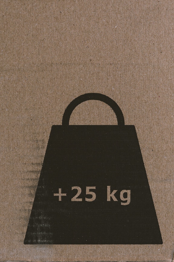 Tecken på en vikt på kilogram (25 kg) på brun kartong