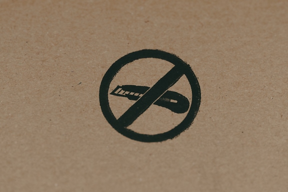 No knife sign on a brown cardboard