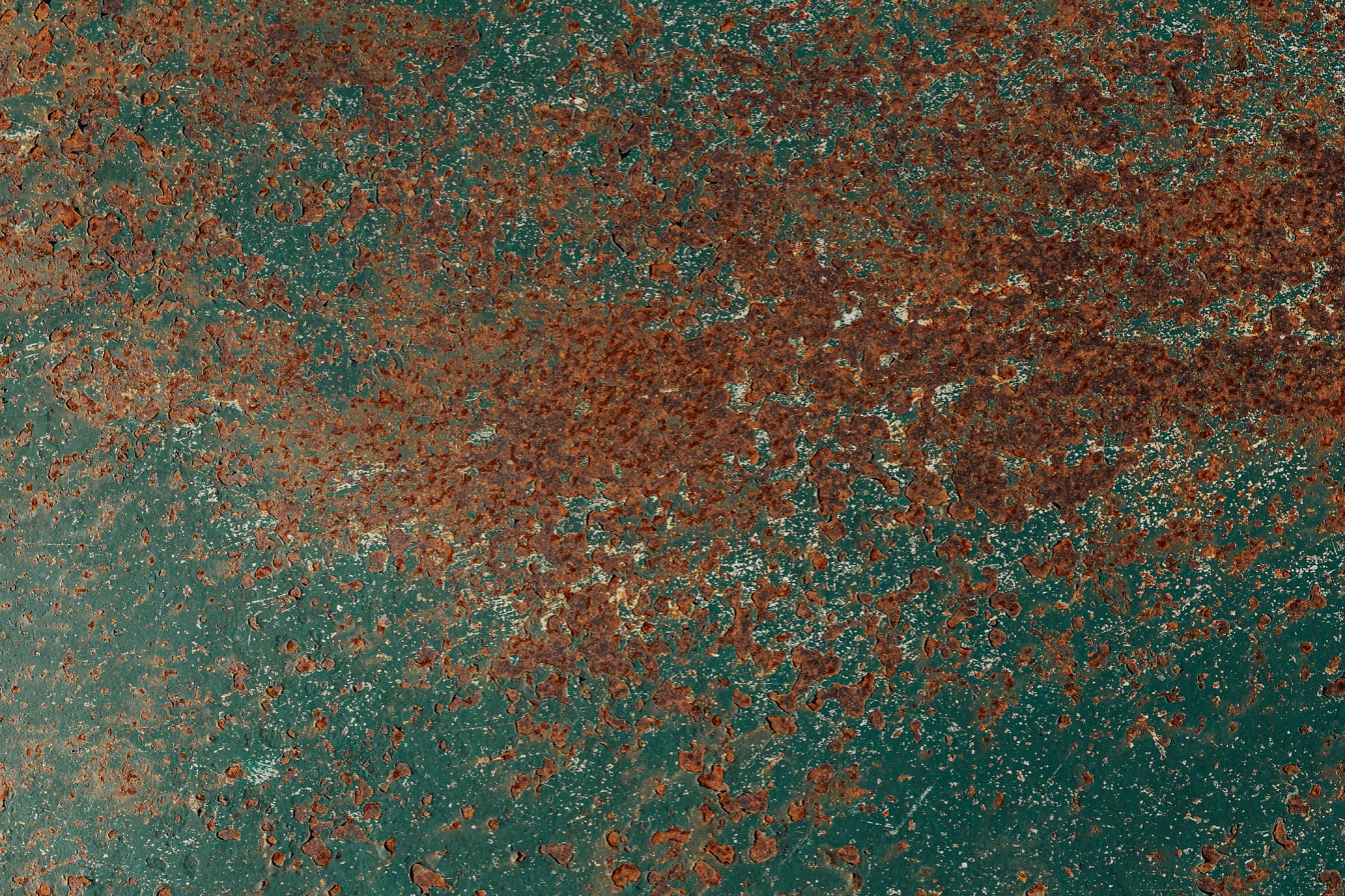 Óxido en una textura de primer plano de una superficie metálica verde
