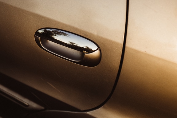 Close-up of shining chrome car door handle