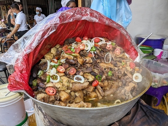 Large pot with boiled seafood on street in Nicaragua