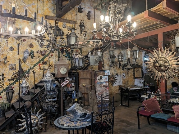 Restaurant with an interior in eclectic style with a large chandelier