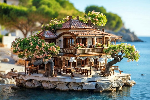 Bonsai arrangement met huis op een rotseiland omringd door water in Kroatië