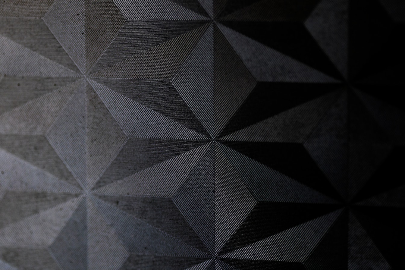 Suprafață din material negru de fum cu textura triunghiului asimetric
