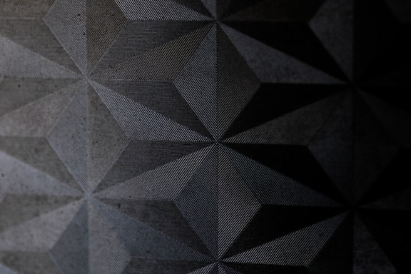 Surface of black carbon material with texture of asymmetric triangle