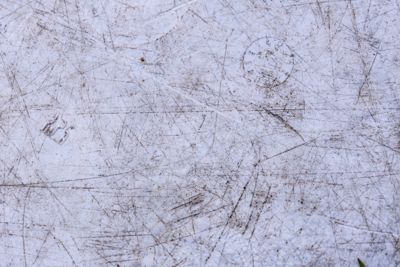 Texture of white dirty plastic surface with scratch marks