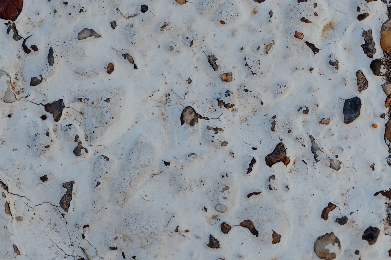 Υφή λευκού χρώματος σε επιφάνεια ακατέργαστου σκυροδέματος