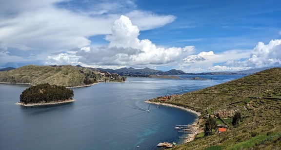 Panorama of lake Titicaca in Bolivia with small island in it