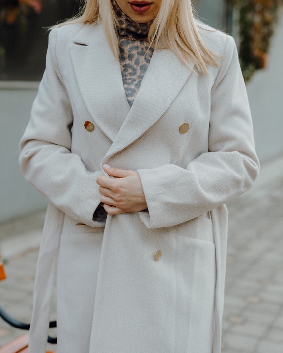 Businesswoman wearing a white coat
