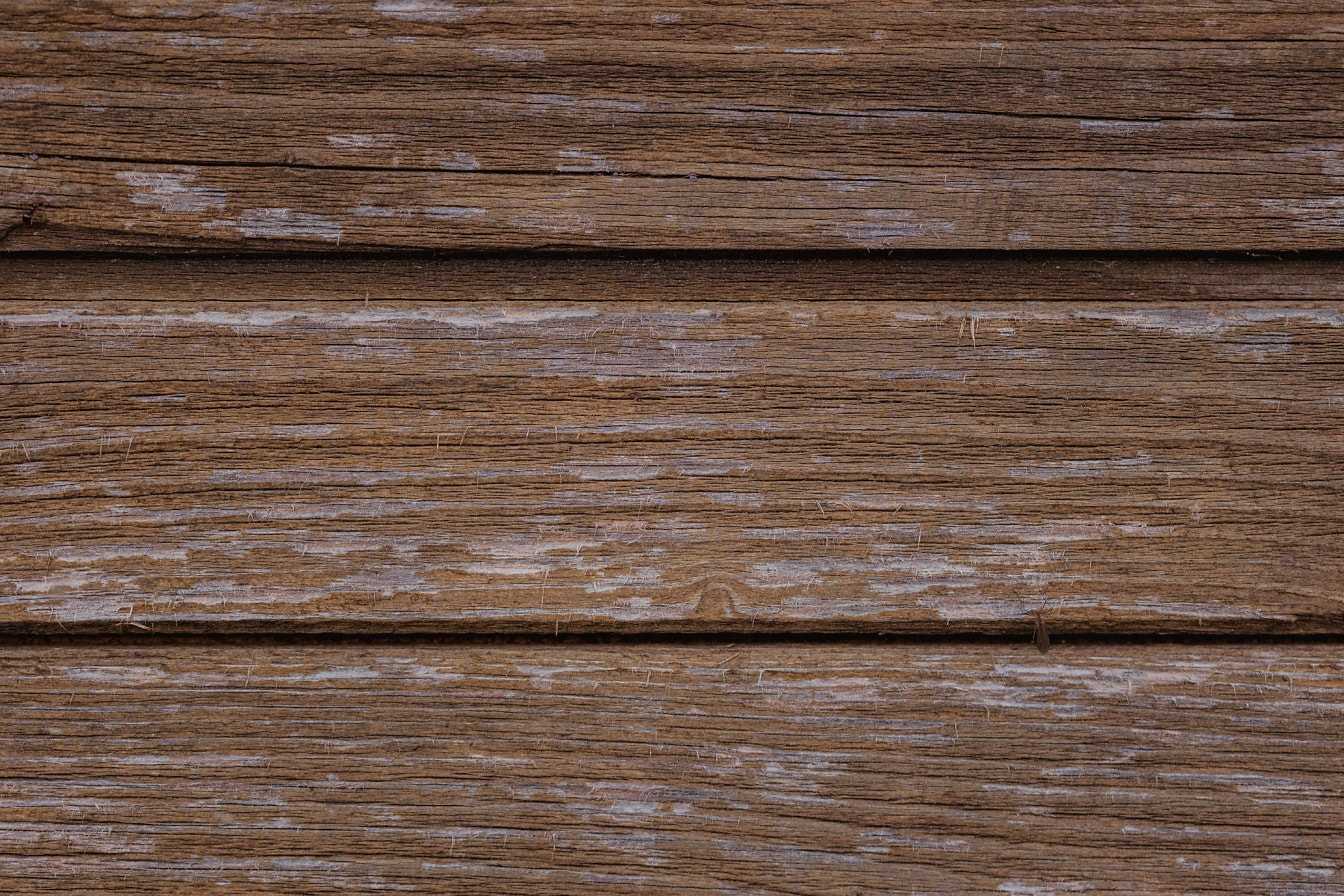 色あせた茶色のペンキで塗られた水平の板で作られた木材パネルの質感