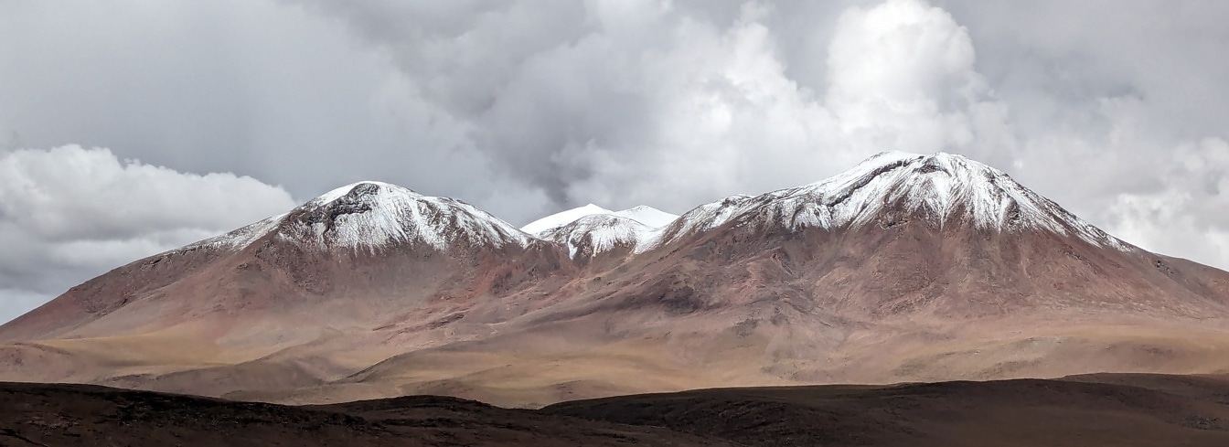 Snowy mountain tops in a desert of Atacama in Bolivia in South America