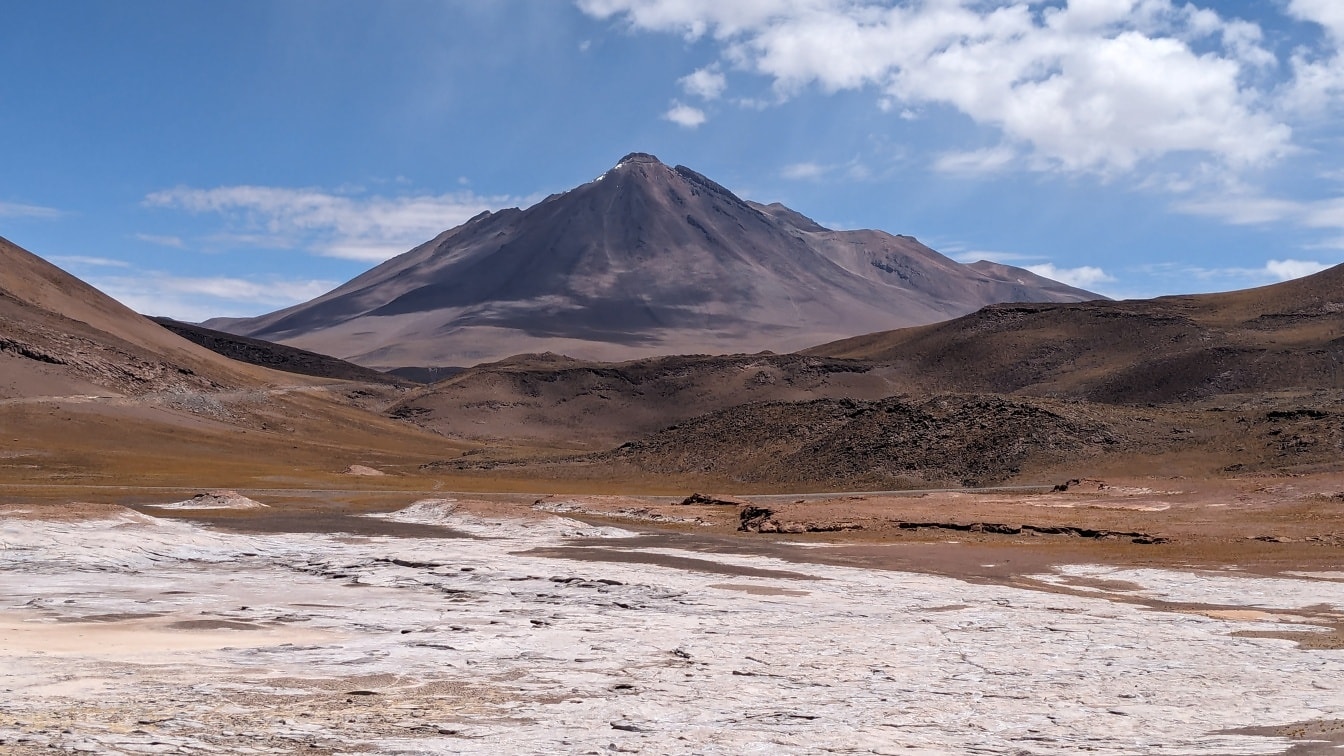 Salt plateau of Altiplano in Chile’s Andes with mountain peak in the distance
