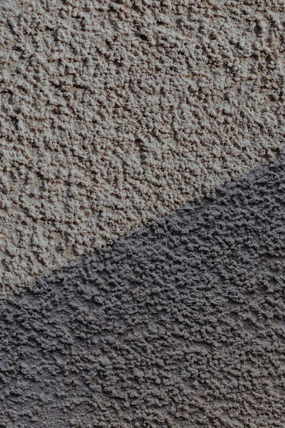 거친 회색을 띤 시멘트가 있는 벽면의 질감