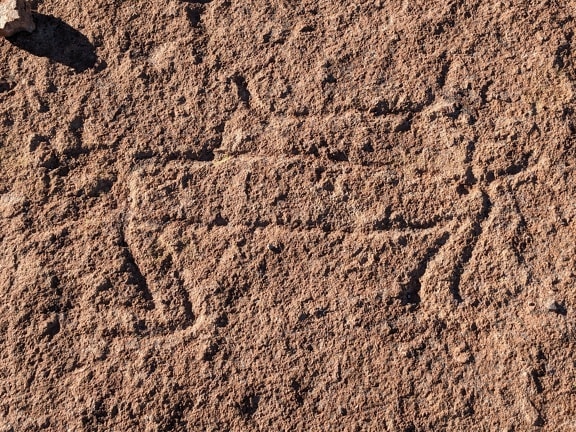 An ancient petroglyphs, rock carvings in South America dated to the prehistoric period