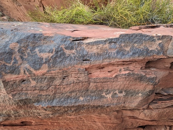 A petroglyphs depicting life of neolith humans, created in prehistoric age