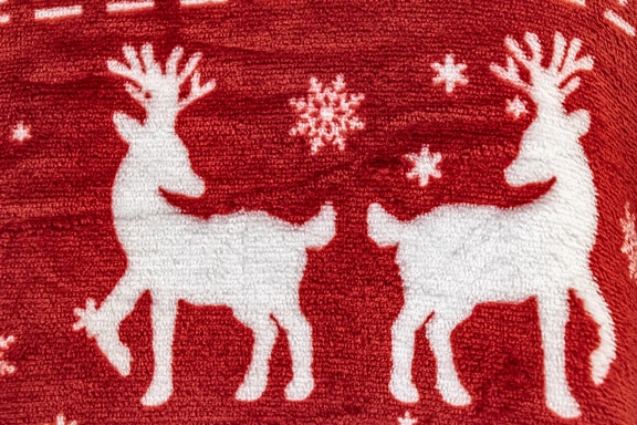 Dark red and white christmas style towel with reindeer and snowflakes