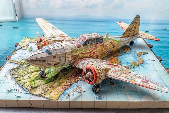 A 3D model of an airplane on a relief maritime map