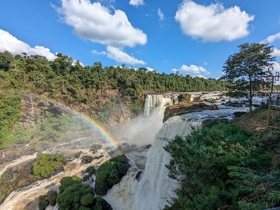 Rainbow over waterfall in national park in Paraguay on river called the Monday