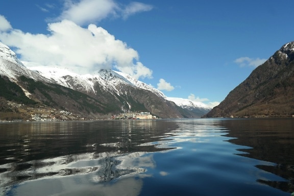 Calm Nordic landscape of Sørfjorden fjord in Norway with the town of Odda in the background in Norway, Scandinavia