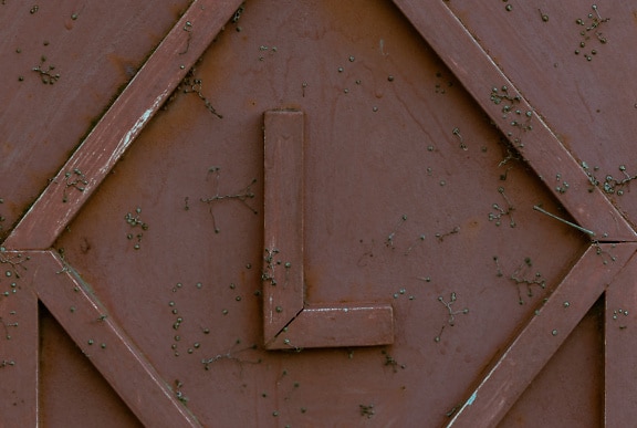 Metal surface with tubes shaped into the letter L