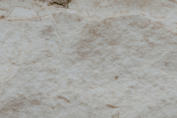 Primer plano de una textura de piedra beige