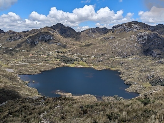 Lake surrounded by mountains in natural park Cajes in Ecuador
