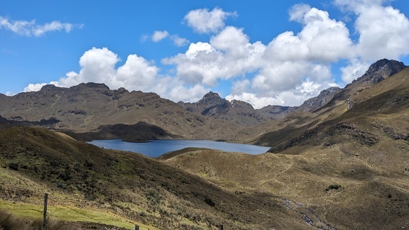 Laguna Luspa a lake surrounded by mountains in natural park Cajas in Ecuador