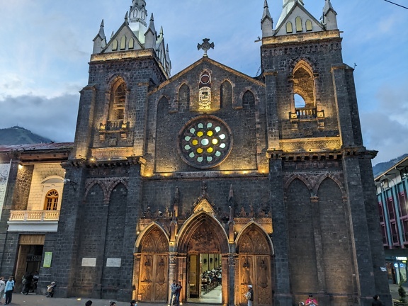 Exterior of the Roman Catholic church of the Virgin of the Holy Water in Banos de Agua Santa in Ecuador at night