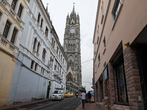 A street in Quito city in Ecuador with a Roman Catholic neo-Gothic basilica of the National Vow