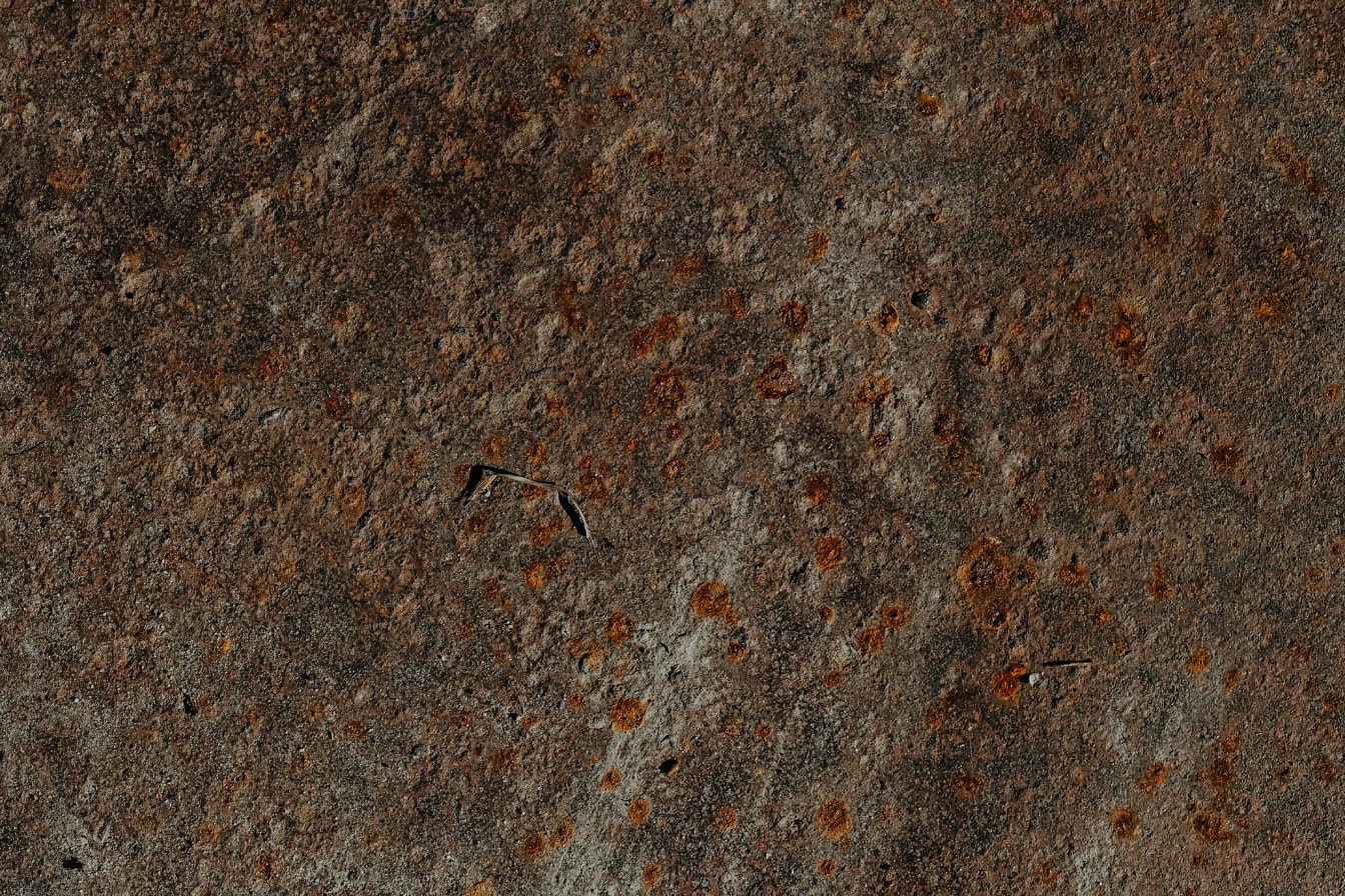 Texture of dirty flat iron surface close-up with rust stains