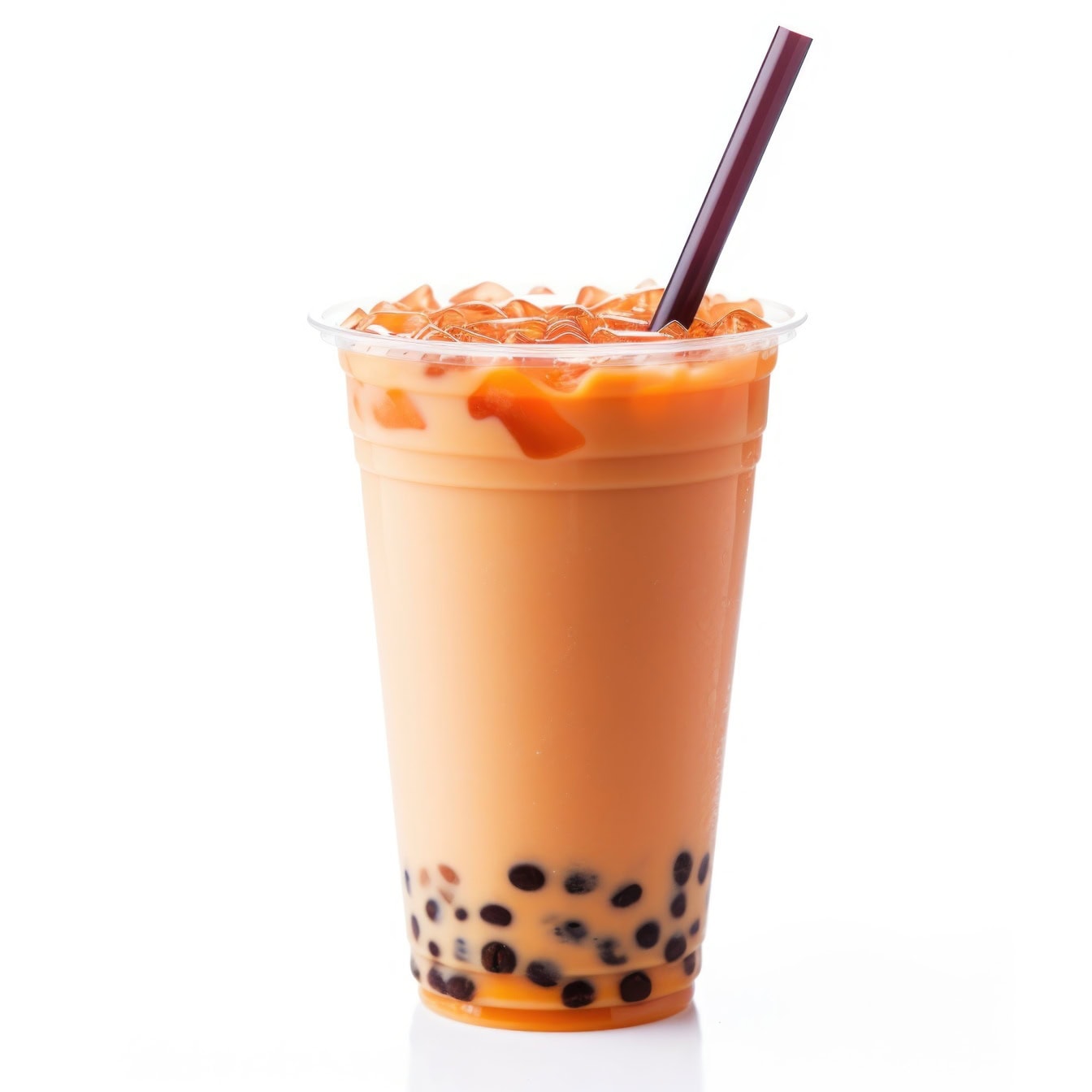 Cup of refreshing cold Thai milk tea with drinking straw