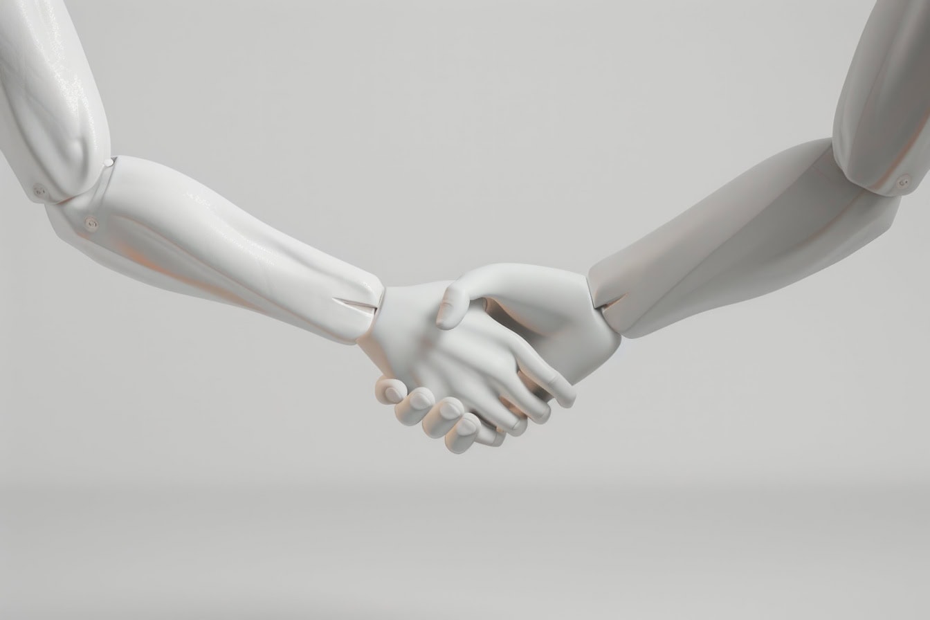 Poignée de main de deux robots humanoïdes