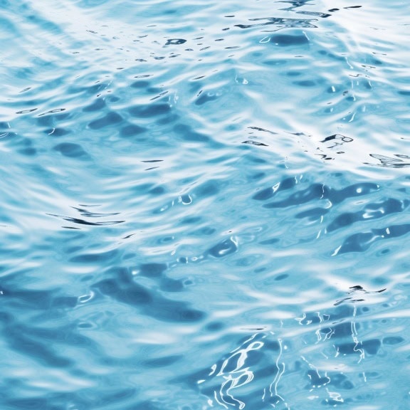 Datagrafikk av tekstur av bølger av turkisblått vann