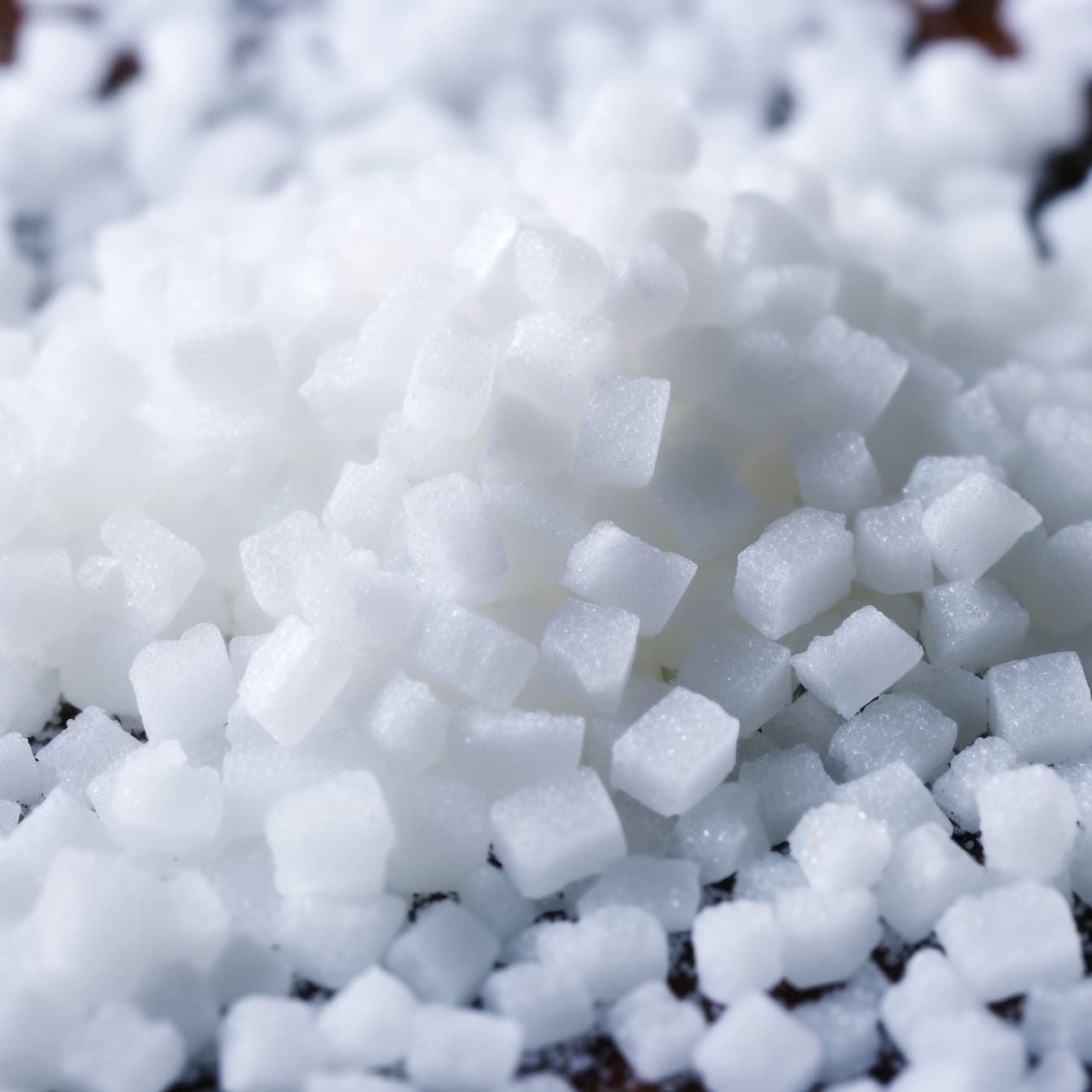 Close-up of pile of white sugar cubes