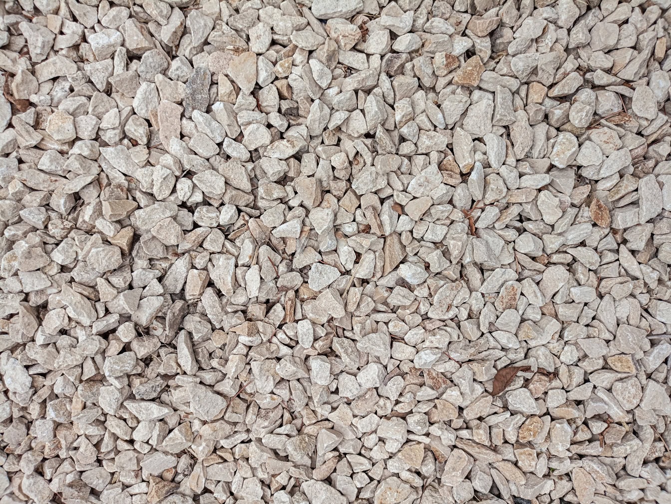Texture of small greyish-white granite stones