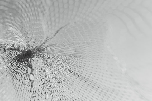 Black and white texture of transparent nylon mesh close-up