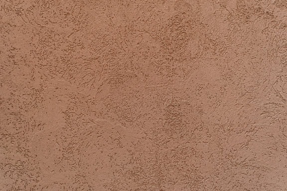 얕은 구호와 주황색 갈색의 외관 시멘트가 있는 벽 질감