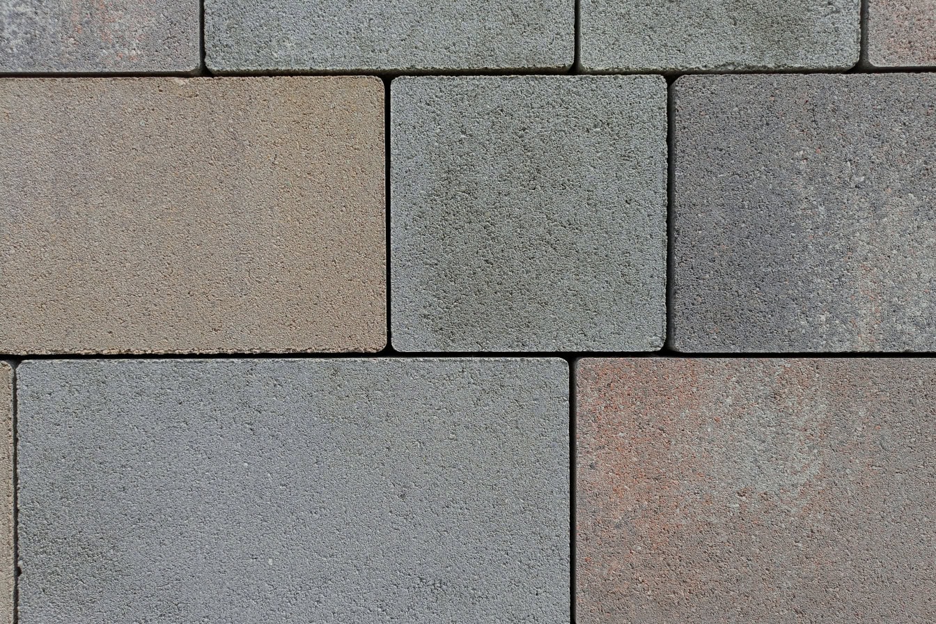Textura blocurilor de piatră artificială pătrată și dreptunghiulară din beton vopsit