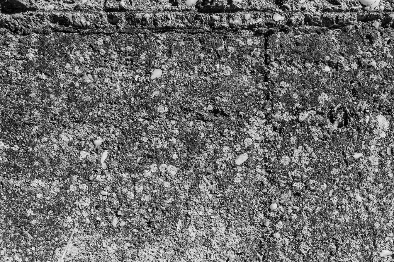 Sort og hvid tekstur af en gammel betonvæg