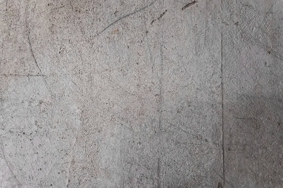 평평한 표면을 가진 더러운 회색 콘크리트의 클로즈업 텍스처