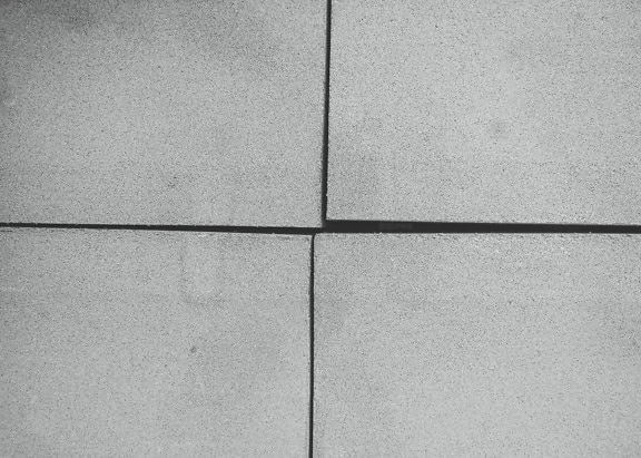 4 개의 콘크리트 블록의 흑백 질감