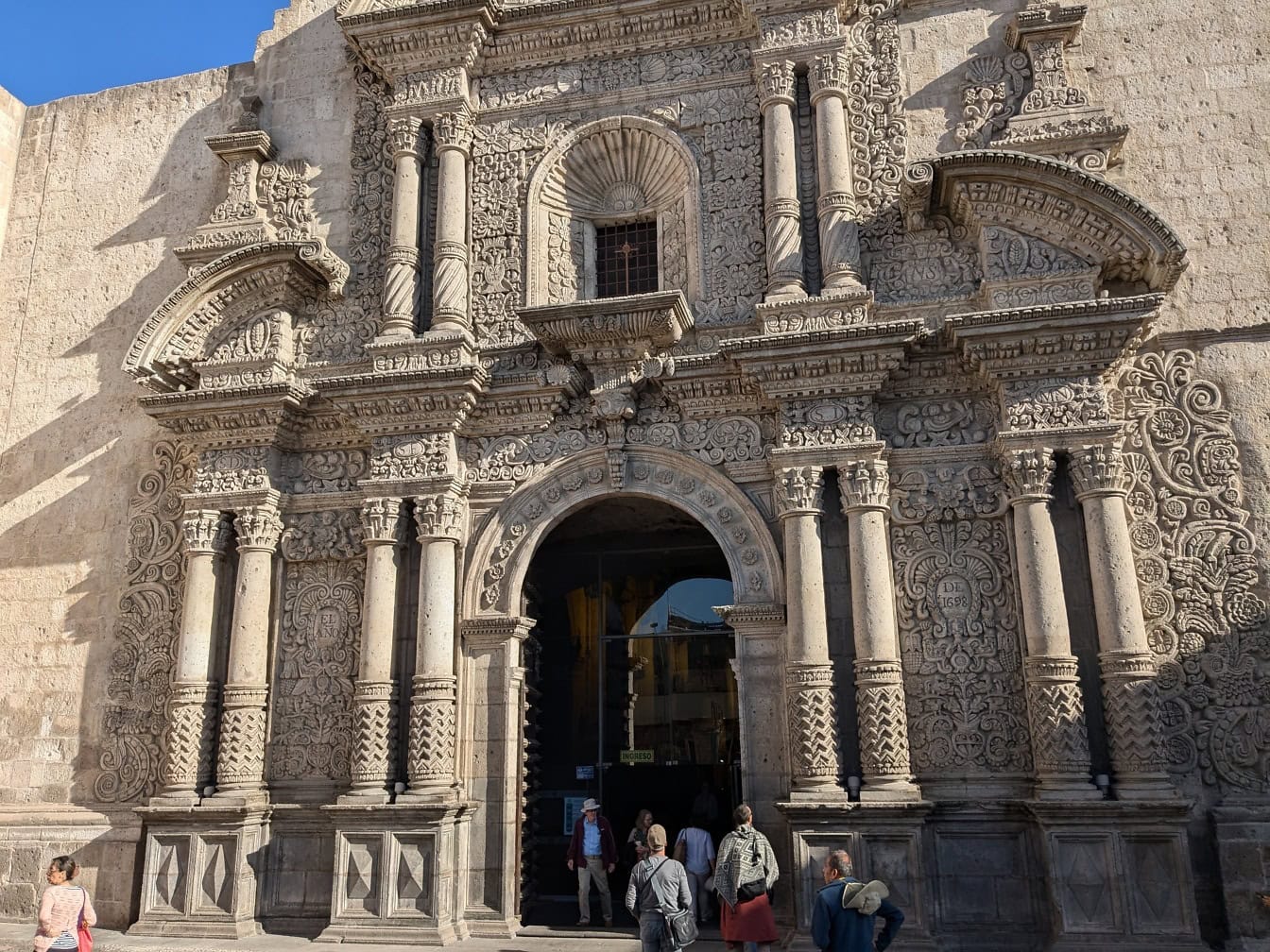 Group of people outside of the church of the Society of Jesus of Arequipa in Peru