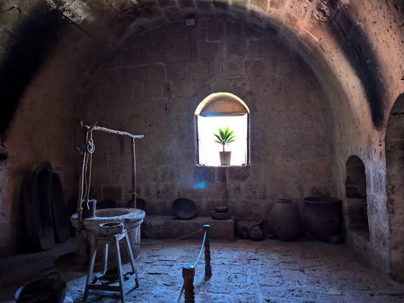Interior of medieval room with a well at Santa Catalina monastery in Peru
