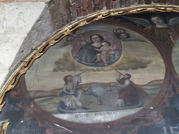 A fresco painting with angels on a ceiling in catholic church in Peru, Latin America
