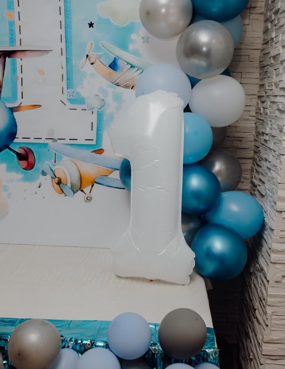 Balloon at the celebration of the 1st birthday in the shape of the number one (1)