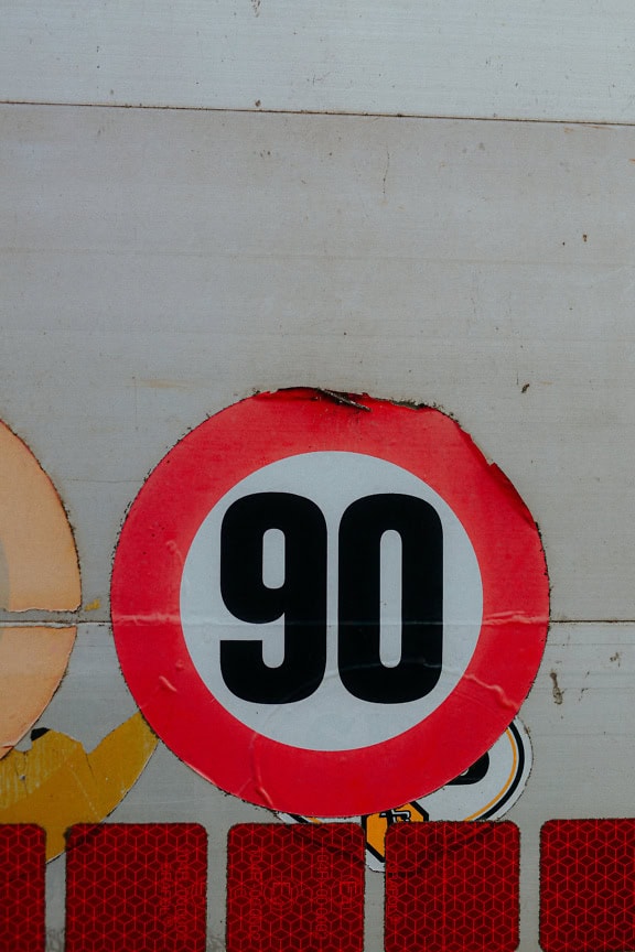 Sticker with a traffic sign speed limit of 90 km/h